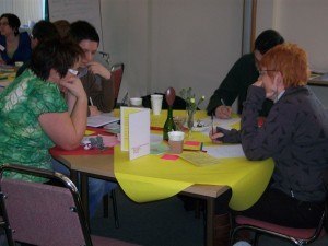 People at table in a world cafe session.