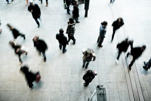 Aerial view of people walking on paved area