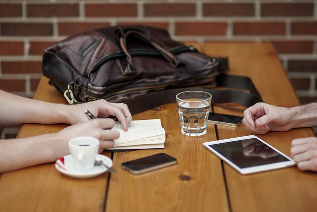 Table between two people meeting over coffee