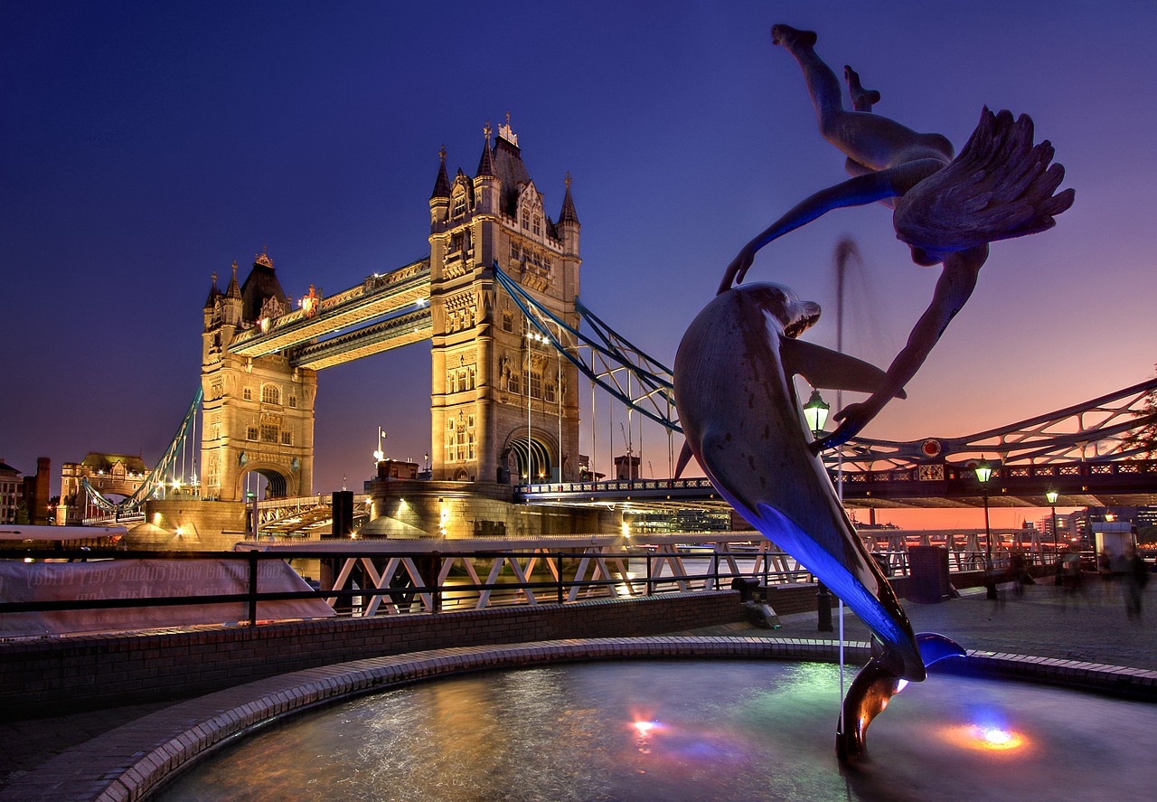 Statue of woman diver and dolphin dancing together