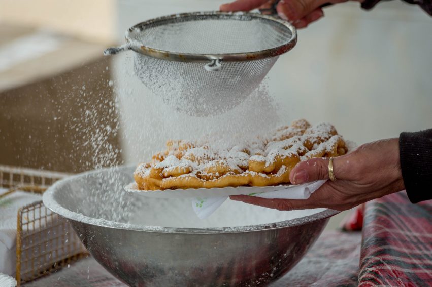 A sieve with icing sugar.