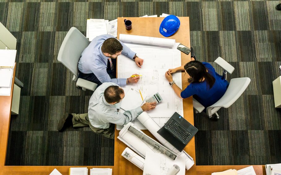 Three people in office meeting