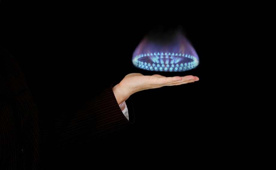 gas ring hovering over a hand